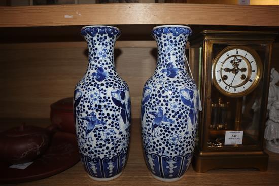 A pair of 19th century Chinese blue and white vases height 30cm